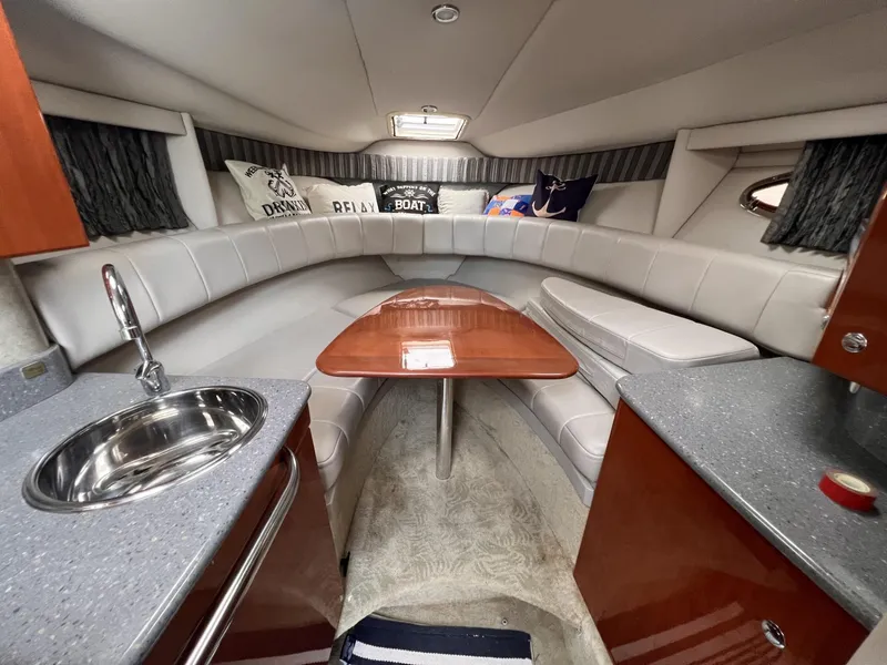 Slide: The Image of 2006 Formula 27 PC cabin interior with seating, table, and kitchenette. - 25