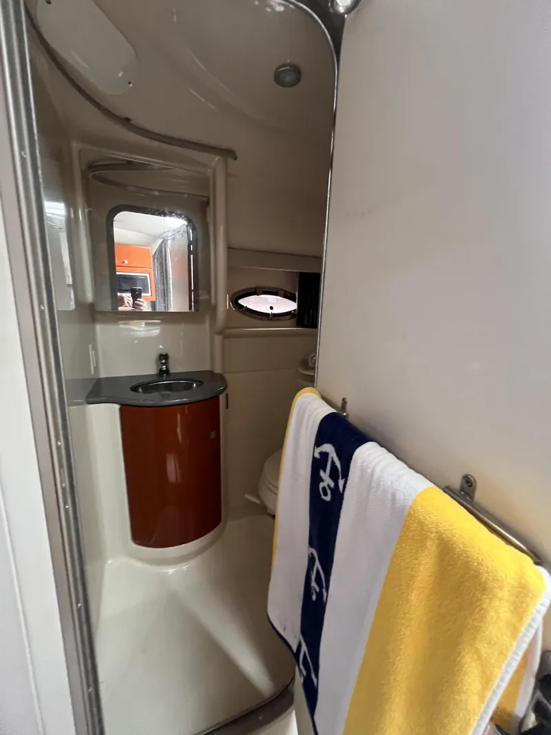 Slide: The Image of 2006 Formula 27 PC boat bathroom with sink, mirror, and towel. - 27