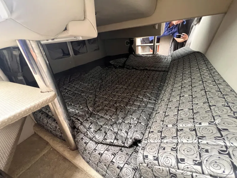 Slide: The Image of Interior cabin of a 2006 Formula 27 PC boat with patterned bedding. - 33