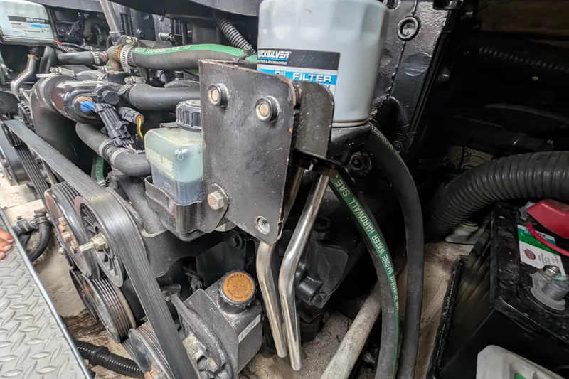 Slide: The Image of Engine components of a 2006 Formula 27 Performance Cruiser, featuring belts and hoses. - 38