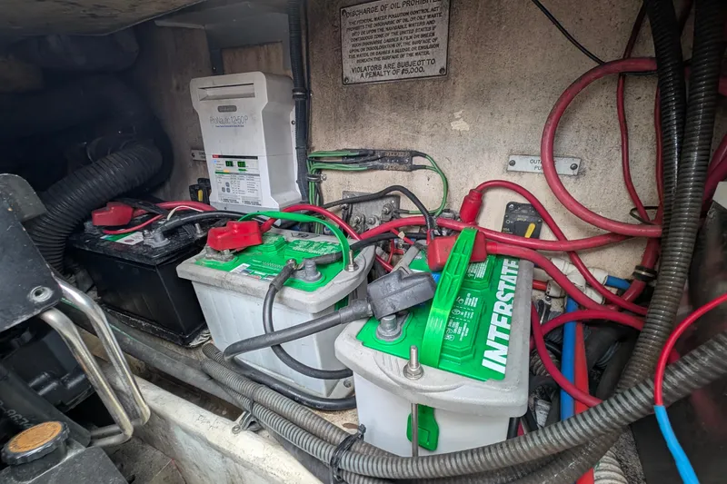 Slide: The Image of Engine compartment of a 2006 Formula 27 Performance Cruiser with batteries and wiring. - 39