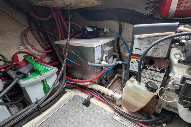 Slide: The Image of Engine compartment of a 2006 Formula 27 Performance Cruiser with wiring and components. - 40