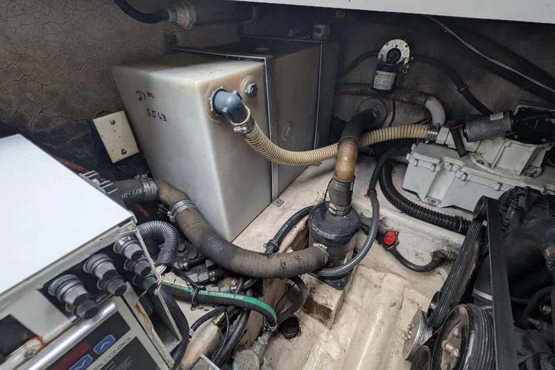 Slide: The Image of Engine compartment of a 2006 Formula 27 Performance Cruiser with visible components and hoses. - 41