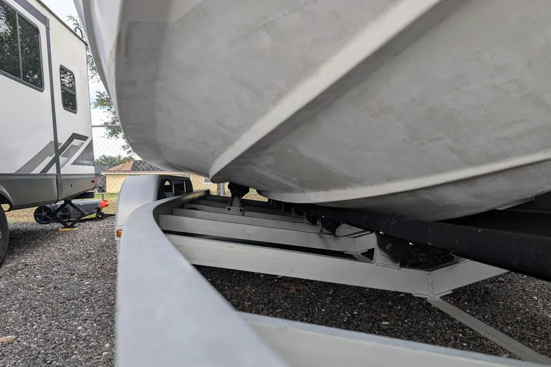 Slide: The Image of 2006 Formula 27 Performance Cruiser on trailer beside RV in gravel lot. - 44