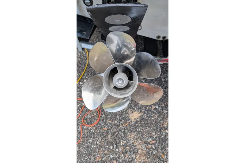 Slide: The Image of 2006 Formula 27 Performance Cruiser propeller on gravel surface. - 52