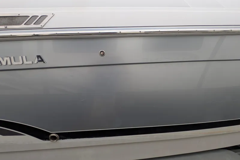 Slide: The Image of 2006 Formula 27 Performance Cruiser boat side view with logo and sleek design. - 7