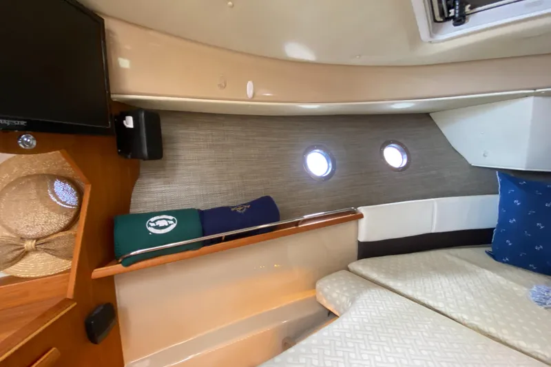 Slide: The Image of Cozy interior of 2016 Ranger Tugs R-29S with portholes and bedding. - 29