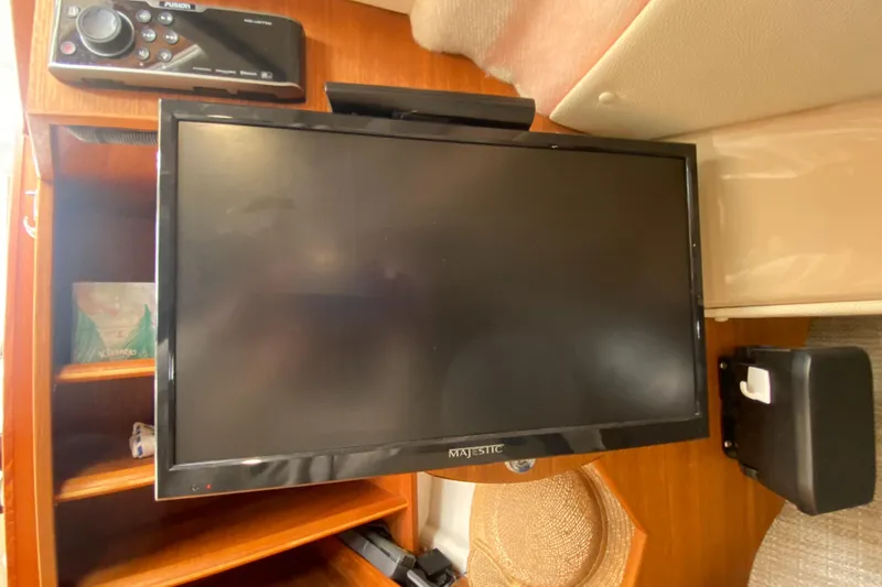 Slide: The Image of Majestic TV and Fusion stereo in 2016 Ranger Tugs R-29S cabin interior. - 34
