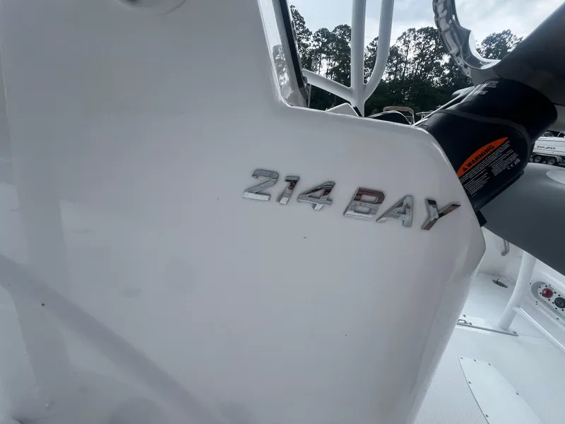 Slide: The Image of 2025 NauticStar 214 Shallow Bay boat, close-up of model name on white surface. - 17
