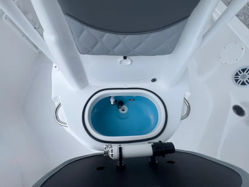 Slide: The Image of 2025 NauticStar 214 Shallow Bay boat interior with livewell and seating. - 22
