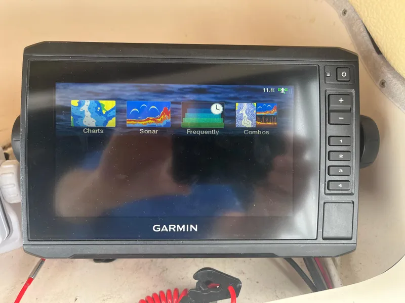 Slide: The Image of Garmin marine GPS display on 2013 Grady-White 22 Seafarer boat, showing charts and sonar options. - 10
