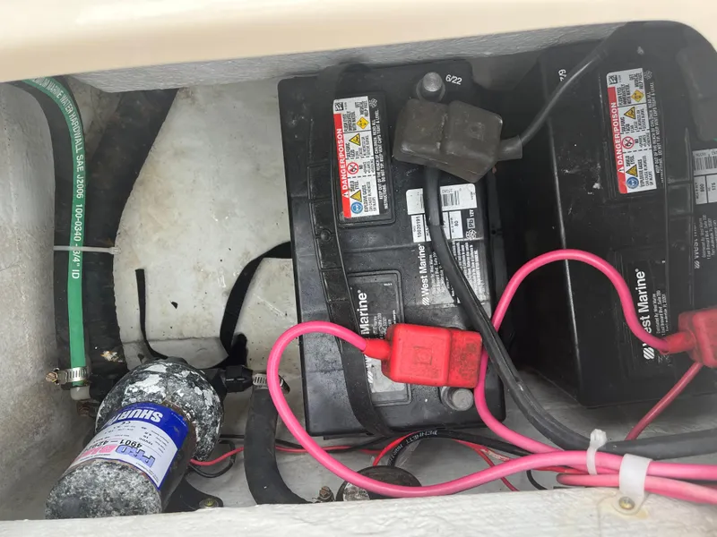 Slide: The Image of Battery compartment of 2013 Grady-White 22 Seafarer with marine batteries and wiring. - 13