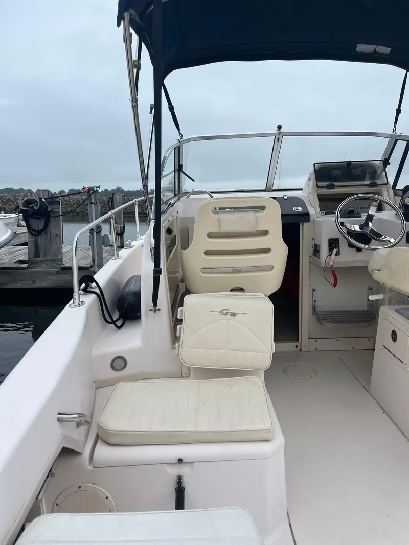 Slide: The Image of 2013 Grady-White 22 Seafarer boat interior with seating and steering wheel. - 15