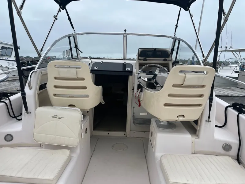 Slide: The Image of 2013 Grady-White 22 Seafarer boat interior with helm and seating. - 16