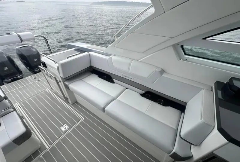 Slide: The Image of 2021 Formula 400 Super Sport Crossover boat interior with sleek seating and modern design. - 10