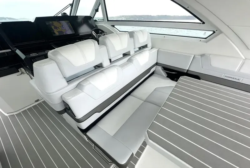 Slide: The Image of 2021 Formula 400 Super Sport Crossover interior with sleek seating and modern dashboard. - 13