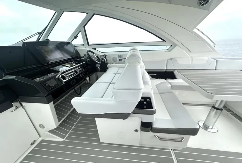 Slide: The Image of 2021 Formula 400 Super Sport Crossover interior with sleek white seating and modern dashboard. - 15