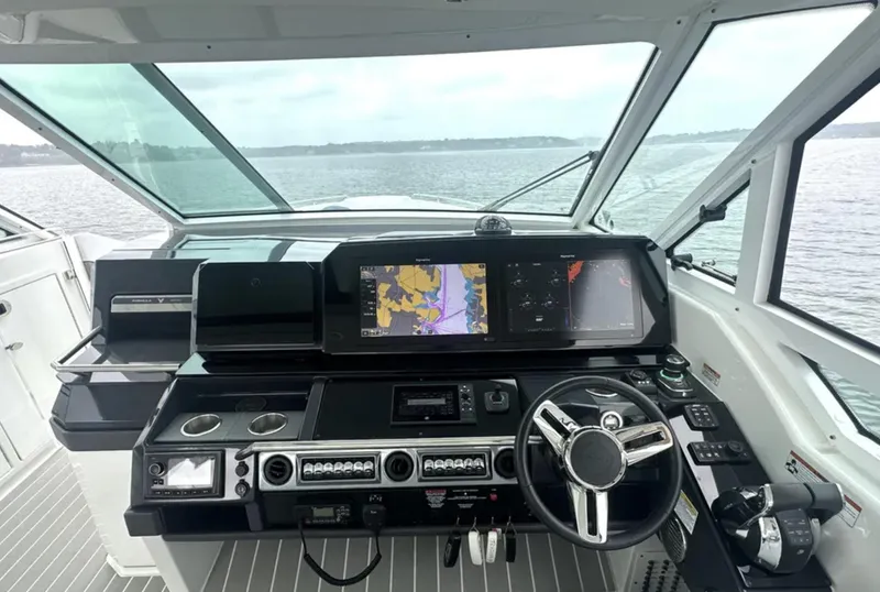 Slide: The Image of 2021 Formula 400 Super Sport Crossover helm with advanced navigation displays. - 17