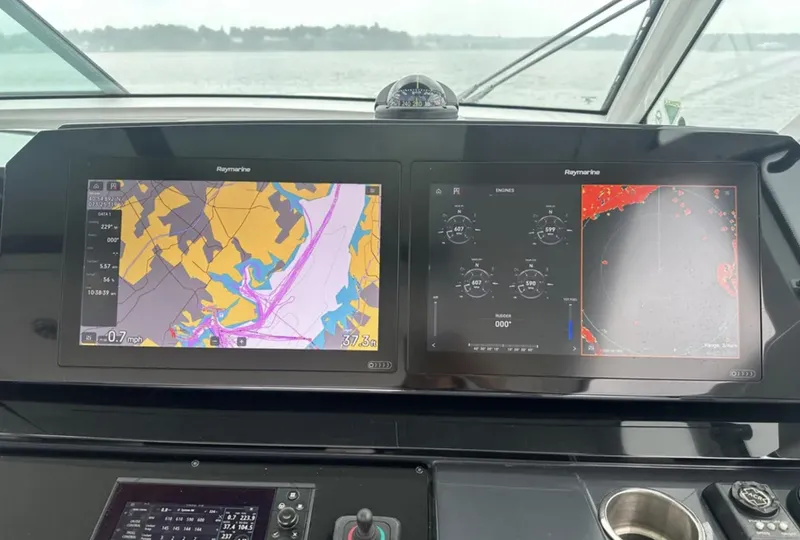 Slide: The Image of Dashboard of a 2021 Formula 400 Super Sport Crossover with navigation screens. - 18