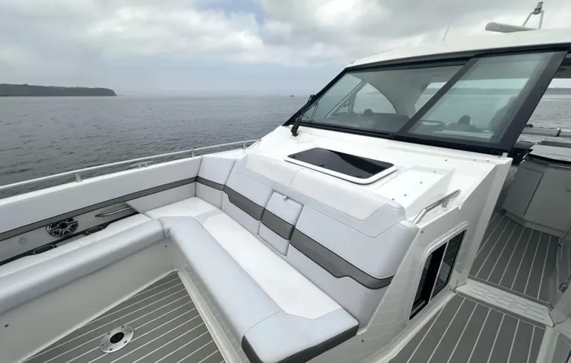 Slide: The Image of 2021 Formula 400 Super Sport Crossover boat interior with sleek seating and ocean view. - 22