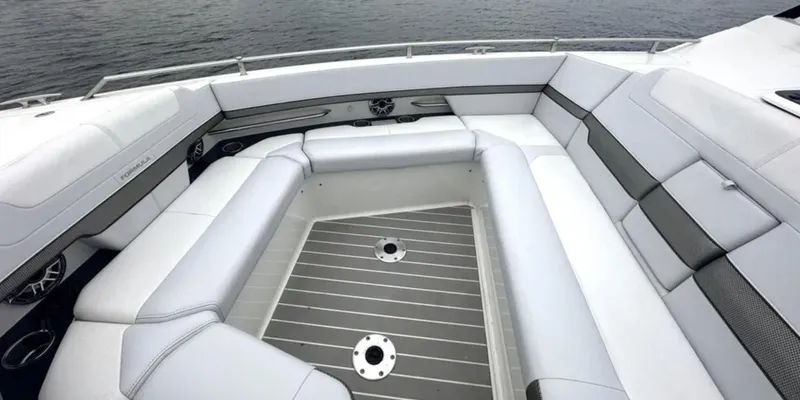 Slide: The Image of 2021 Formula 400 Super Sport Crossover boat interior with spacious seating and sleek design. - 23