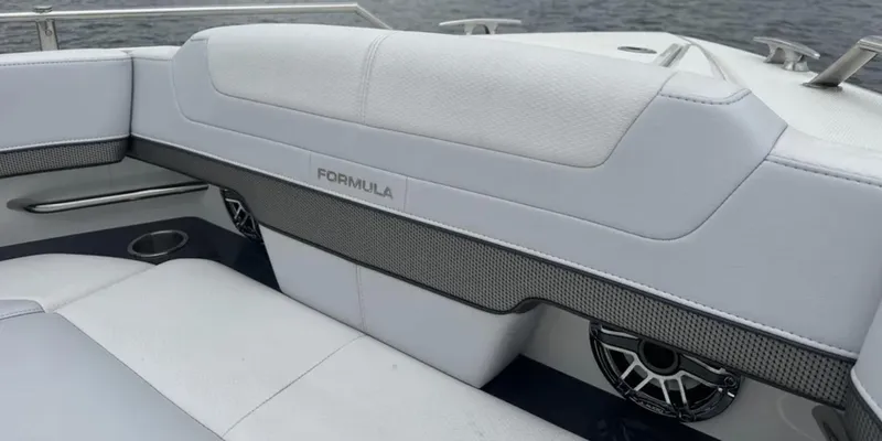 Slide: The Image of 2021 Formula 400 Super Sport Crossover boat interior with sleek seating and speaker detail. - 26