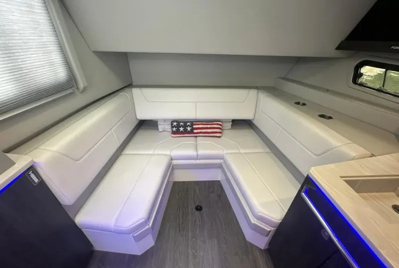 Slide: The Image of 2021 Formula 400 Super Sport Crossover interior with white seating and American flag pillow. - 29