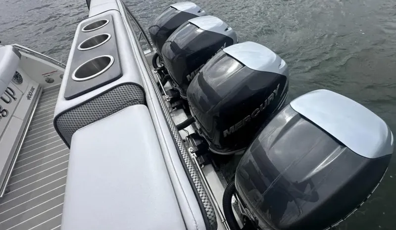 Slide: The Image of 2021 Formula 400 Super Sport Crossover with four Mercury outboard engines on water. - 7