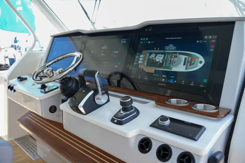 Slide: The Image of 2026 Regal 50 SAV helm with advanced navigation and control systems. - 11