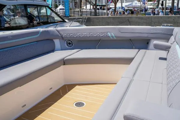 Slide: The Image of Luxurious seating area on 2026 Regal 50 SAV boat, featuring elegant design and spacious comfort. - 13