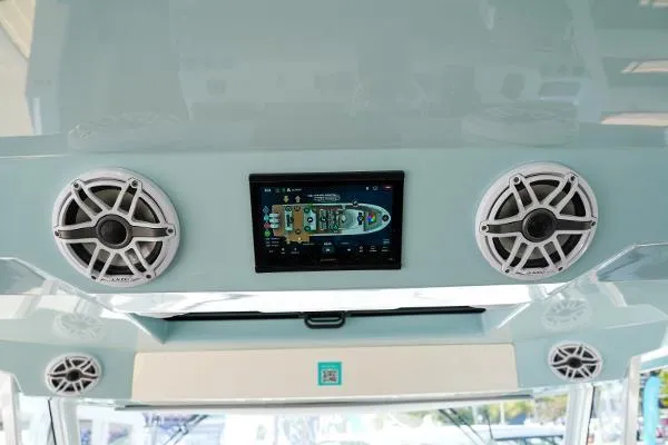 Slide: The Image of 2026 Regal 50 SAV boat interior with speakers and touchscreen display. - 15
