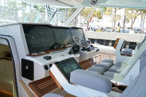 Slide: The Image of Luxurious 2026 Regal 50 SAV yacht cockpit with advanced navigation systems and plush seating. - 18