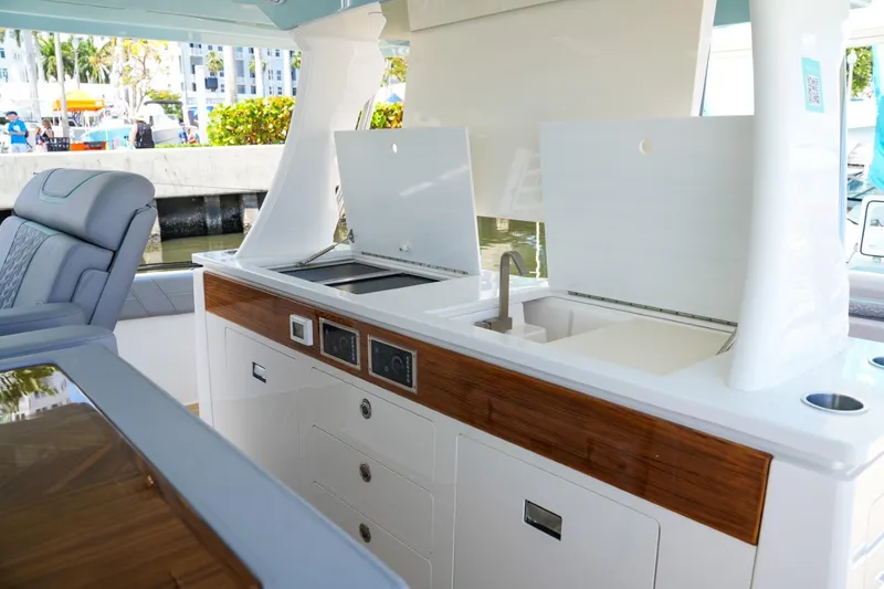 Slide: The Image of Luxurious interior of 2026 Regal 50 SAV yacht featuring modern kitchen amenities. - 19
