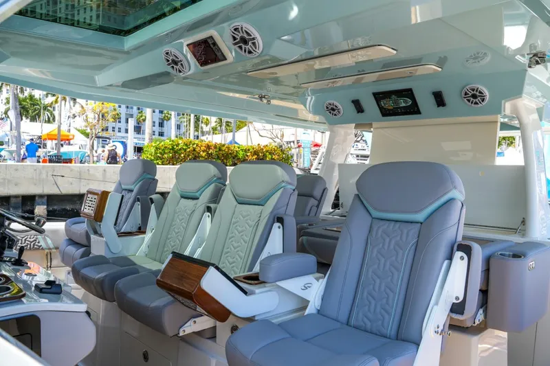 Slide: The Image of Luxurious interior of 2026 Regal 50 SAV yacht with modern seating and controls. - 21
