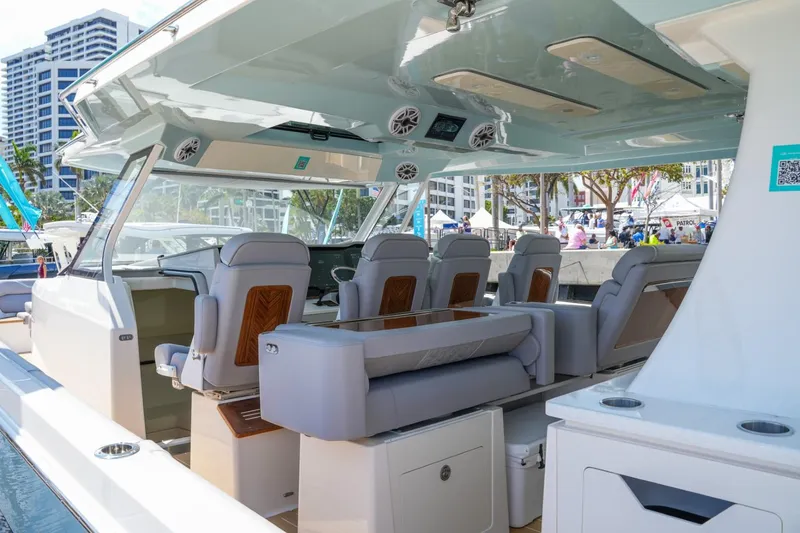 Slide: The Image of 2026 Regal 50 SAV luxury yacht interior with modern seating and sleek design. - 23