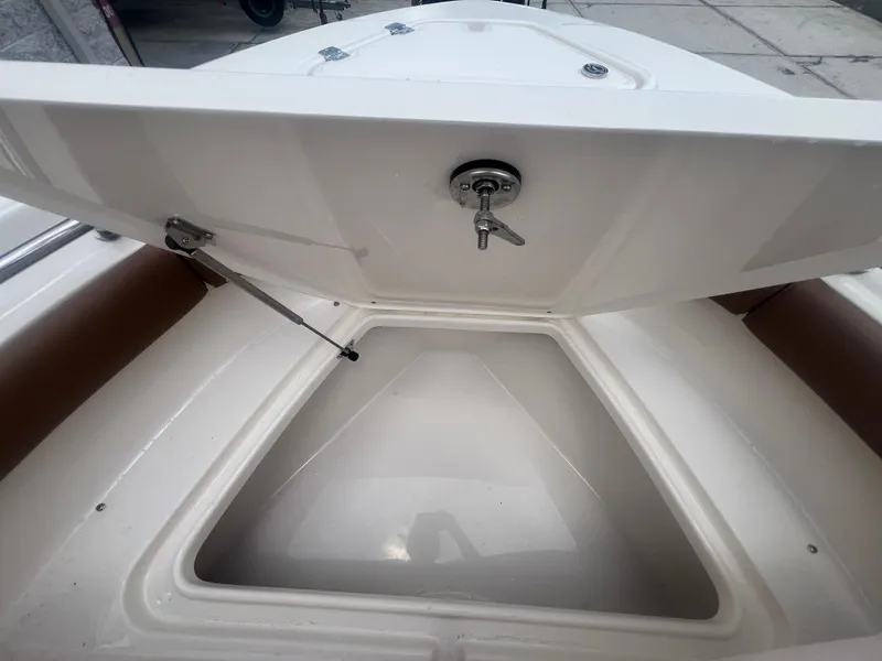 Slide: The Image of Open storage compartment on 2026 Pioneer 202 Islander boat, showcasing interior space. - 20