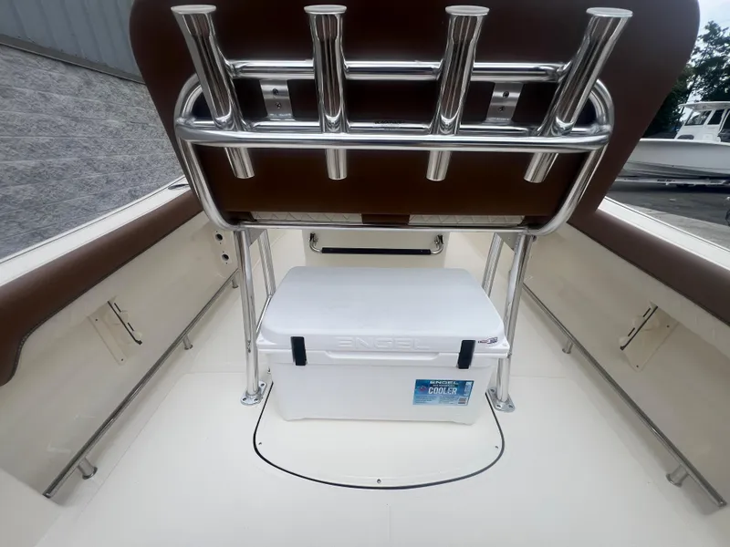 Slide: The Image of 2026 Pioneer 202 Islander boat interior with Engel cooler and rod holders. - 8