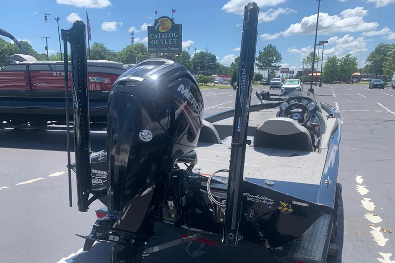Slide: The Image of 2017 Tracker Pro Team 190 TX boat with Mercury engine in parking lot. - 2