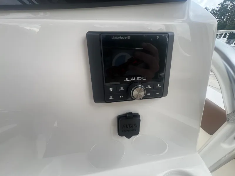 Slide: The Image of JL Audio system on 2026 Pioneer 202 Islander boat dashboard. - 12