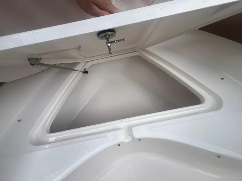 Slide: The Image of Open storage compartment on 2026 Pioneer 202 Islander boat. - 17