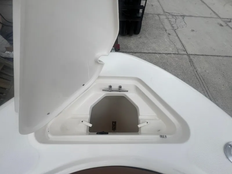 Slide: The Image of Open storage compartment on 2026 Pioneer 202 Islander boat, showing interior space. - 19