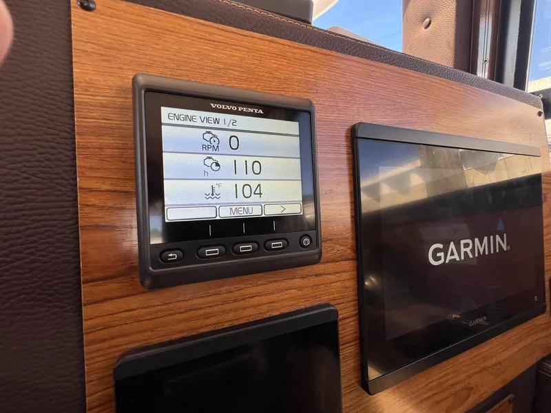 Slide: The Image of Volvo Penta engine display and Garmin screen on 2025 Ranger Tugs R-29 CB boat. - 32