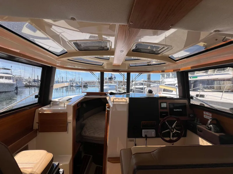 Slide: The Image of Interior view of 2025 Ranger Tugs R-29 CB boat with helm and cabin. - 34