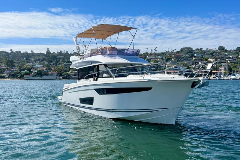 Slide: The Image of 2017 Jeanneau Velasco 43 yacht cruising on scenic coastal waters. - 1