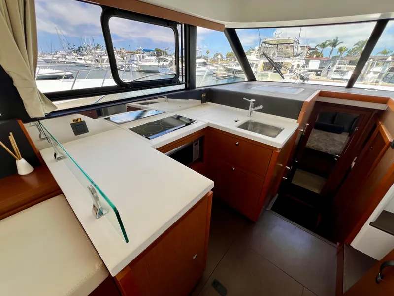 Slide: The Image of Modern kitchen interior of 2017 Jeanneau Velasco 43 yacht with marina view. - 10