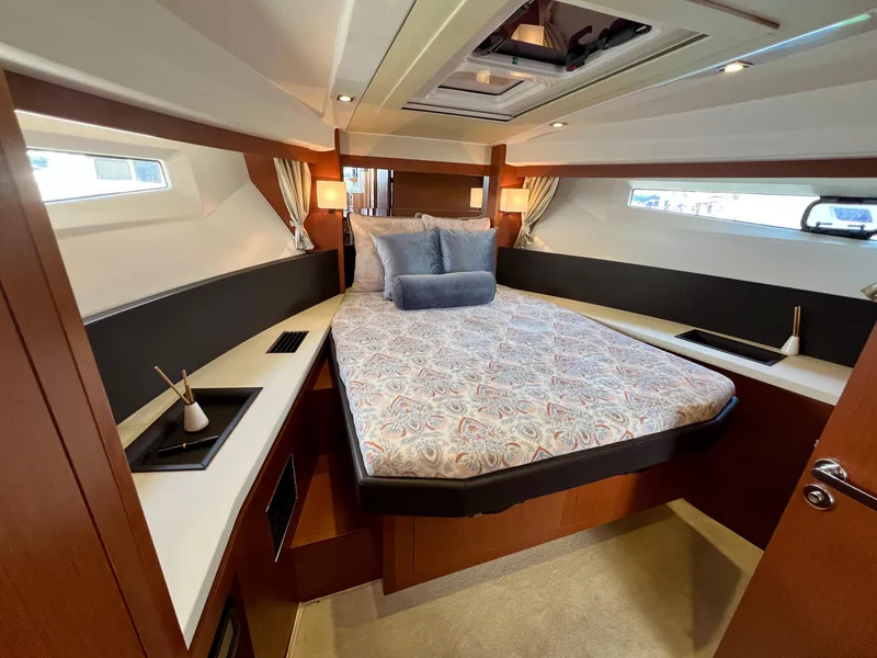 Slide: The Image of Luxurious cabin interior of 2017 Jeanneau Velasco 43 yacht with elegant bedding and modern design. - 13