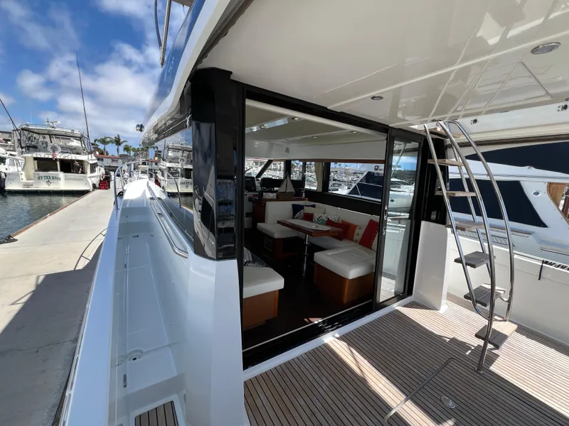 Slide: The Image of 2017 Jeanneau Velasco 43 yacht with open deck, modern interior, docked at marina. - 18