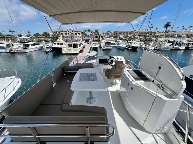 Slide: The Image of Flybridge view of 2017 Jeanneau Velasco 43 yacht docked in a marina. - 19