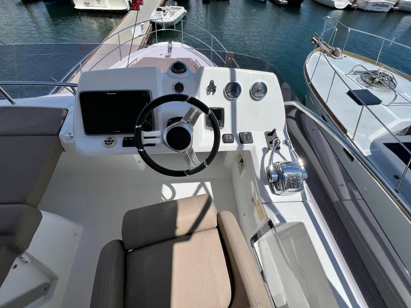 Slide: The Image of Helm of 2017 Jeanneau Velasco 43 yacht with steering wheel and controls. - 25