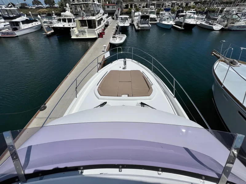 Slide: The Image of 2017 Jeanneau Velasco 43 yacht docked at marina, view from bow. - 32